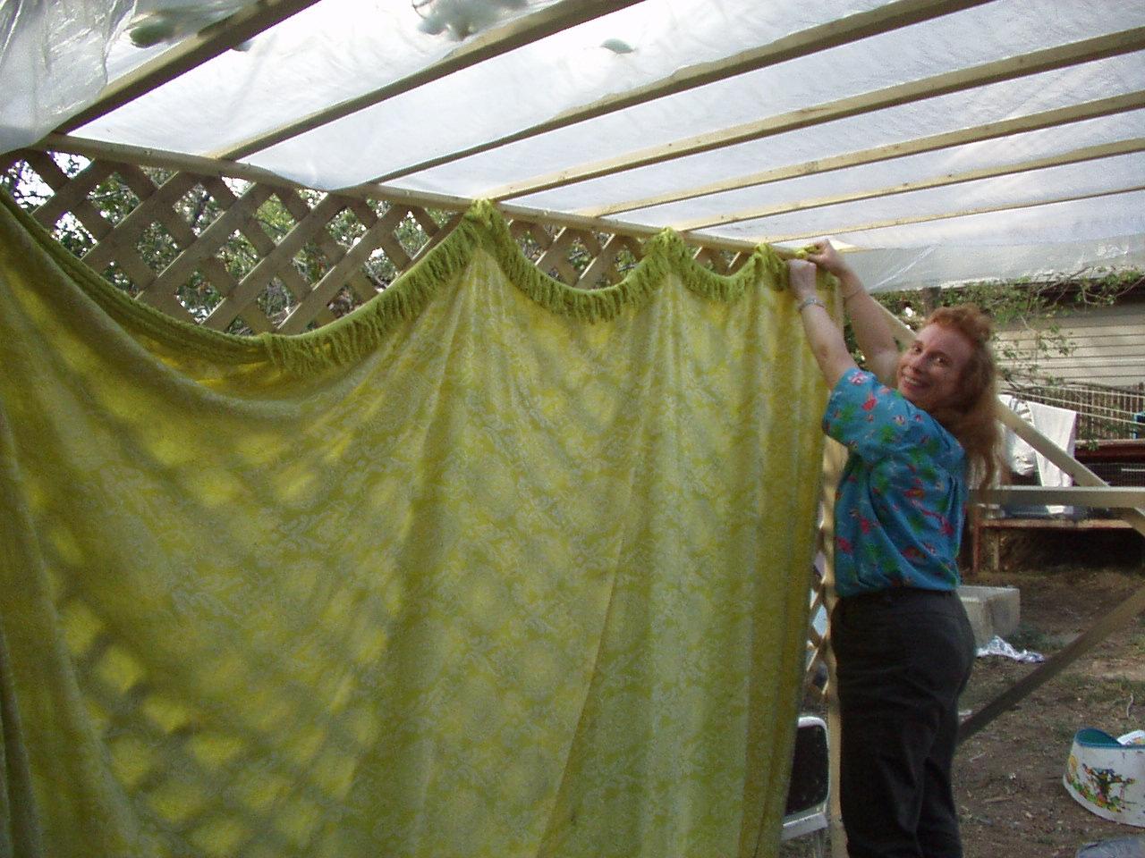 Putting up a bedspread on the west side
